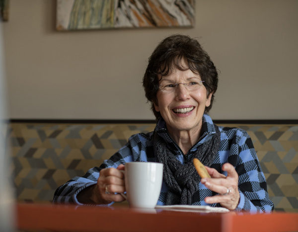 Resident enjoying coffee and cookies