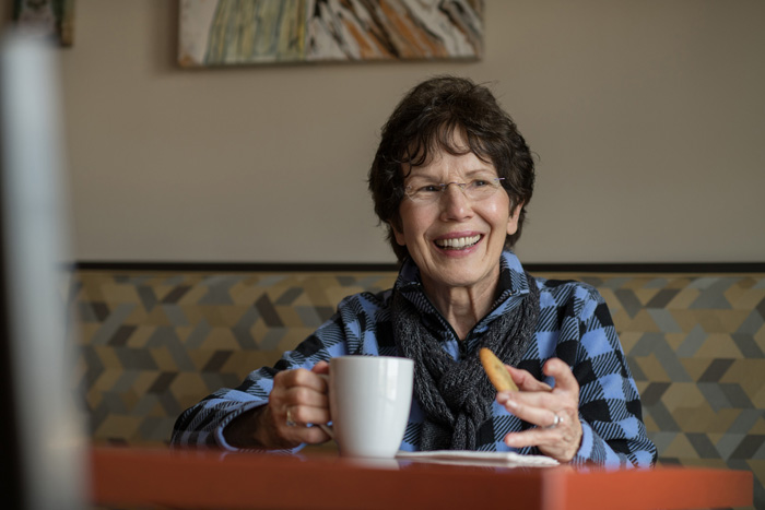 Resident enjoying coffee and cookies