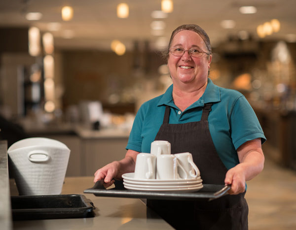 Server with tray of dishes