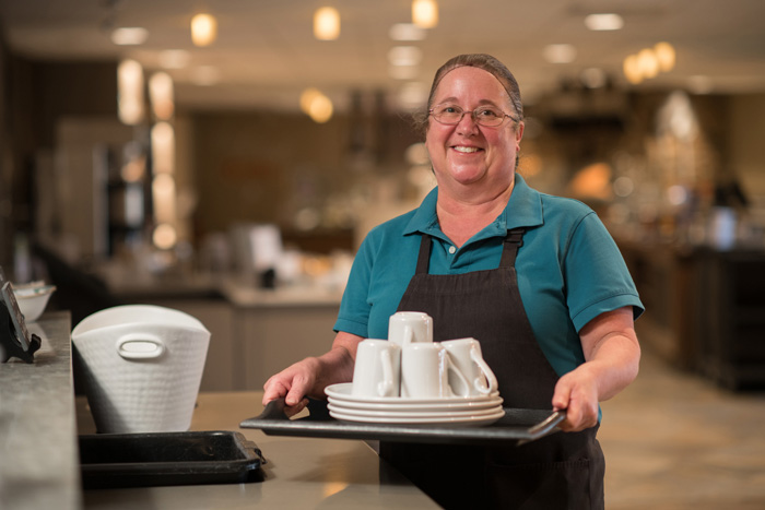 Server with tray of dishes