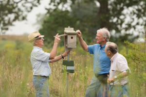 Residents working on a birdhouse