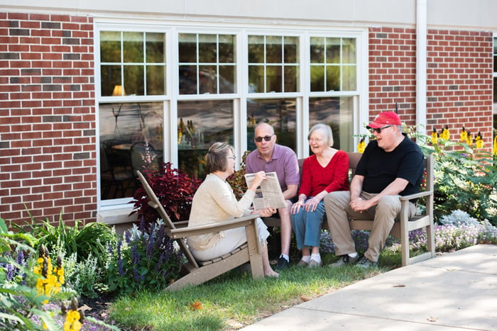 Residents outdoors conversing together