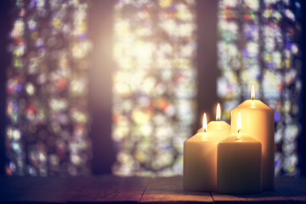 Candles and stained glass windows