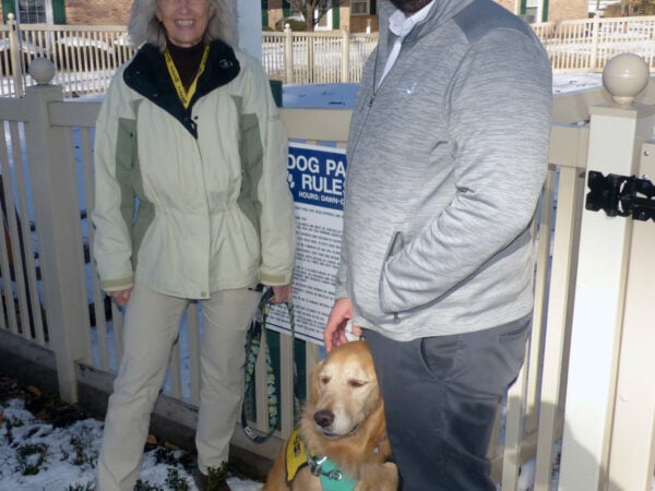 KPETS founder Karen Gerth and her dog Kody, along with Landis Homes Director of Campus Services Adam Gardner.